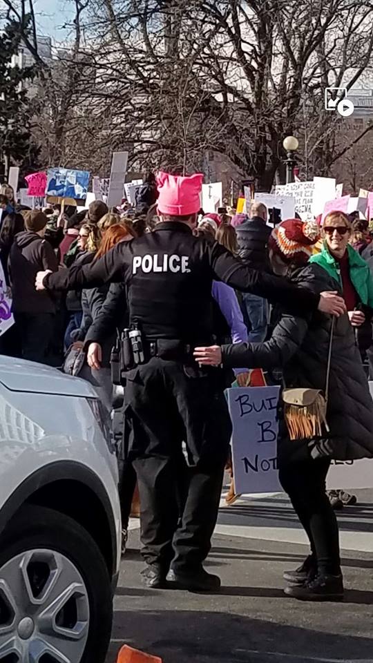 policeman with pink pussy hat